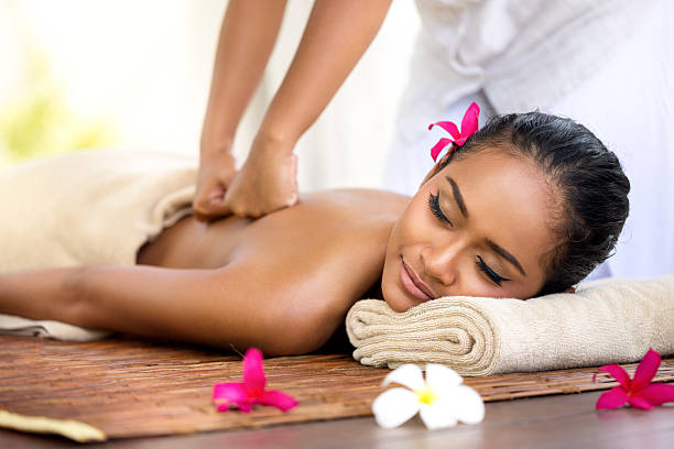 balinese massage in spa environment, deep massage of back